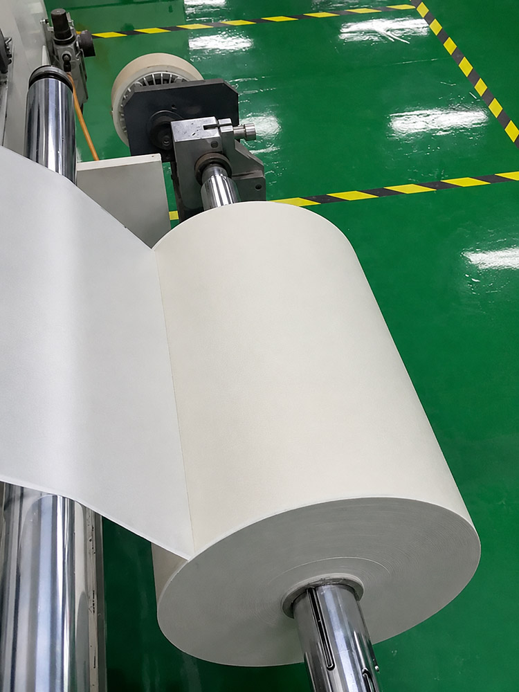 Glass cloth web running through production rollers